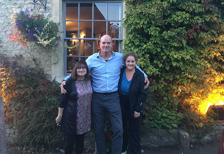 Rita and Annette with Chris outside The Castle Inn, Castle Combe